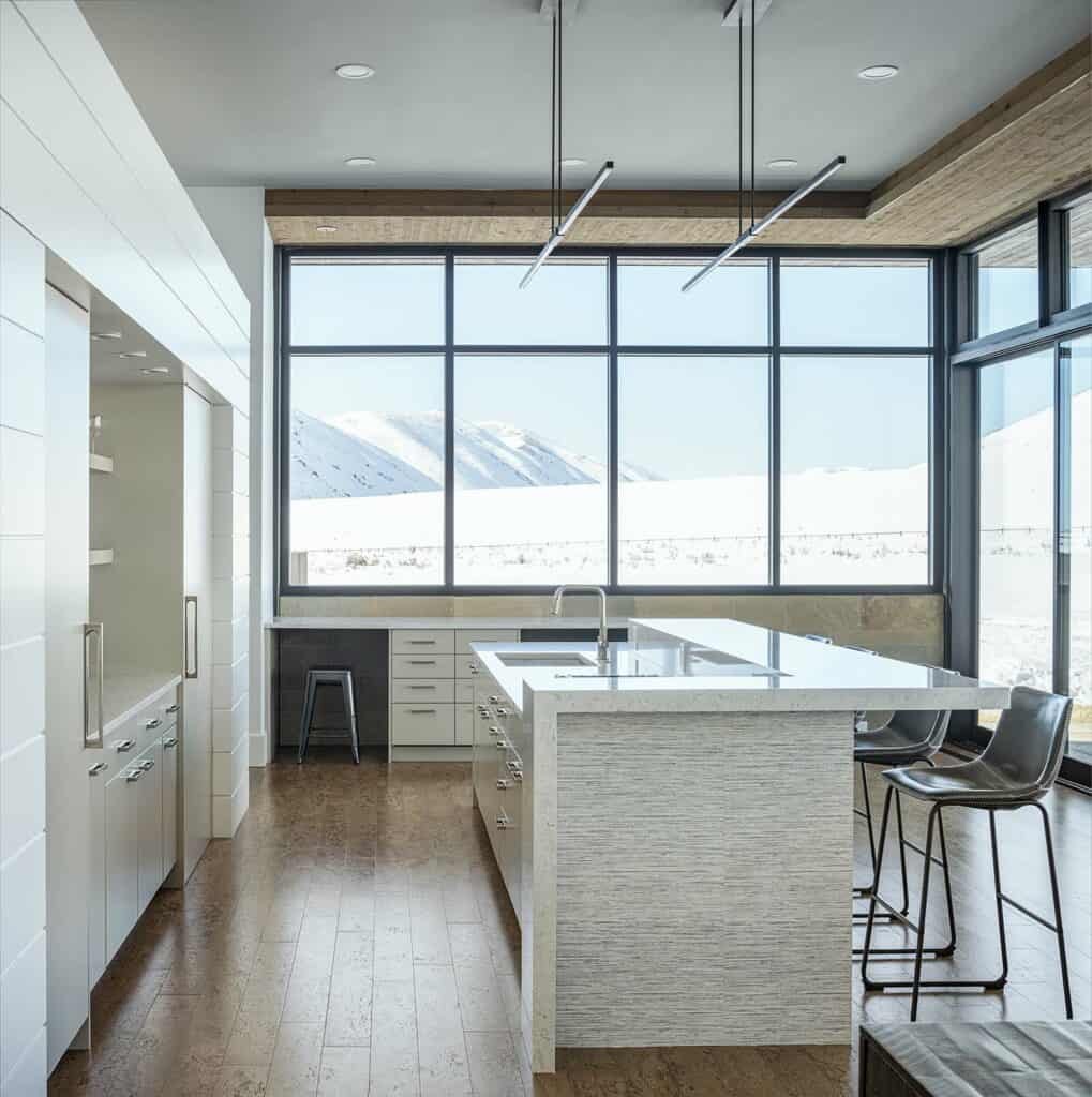 Featured image showing a well designed minimalist mid-century modern kitchen featuring Rocky Mountain Hardware cabinet pulls in white bronze brushed finish.