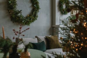 Featured image showing a stylish home interior with Christmas wreath and Christmas tree, festive decorations for winter holidays celebration