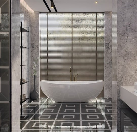 Inline image showing a modern contemporary bathroom with a Contura freestanding bathtub from Amerch placed in front of floor to ceiling windows and sitting on top of geometric tile.