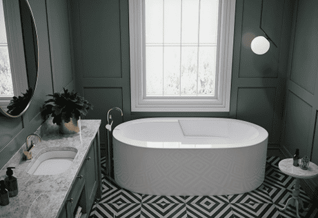 Inline image showing a transitional style bathroom with matte green walls, a free standing tub from Americh and geometric tile all with traditional accents such as marble counters and wainscoting.