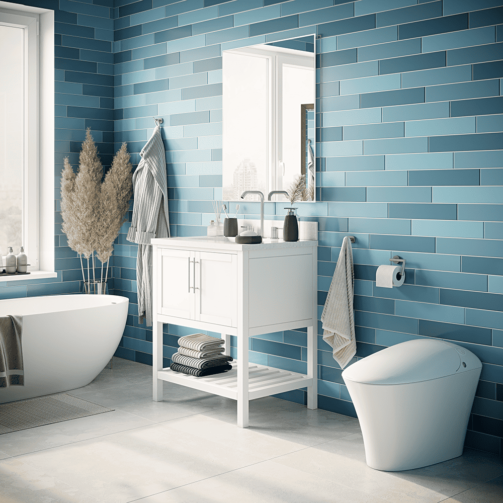 Inline image showing an Icera toilet and Vanity in a modern bathroom with blue subway tile and a standalone bathtub.
